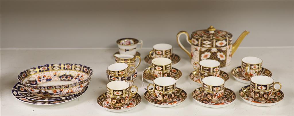 Six Royal Crown Derby coffee cups and saucers and teapot and stand